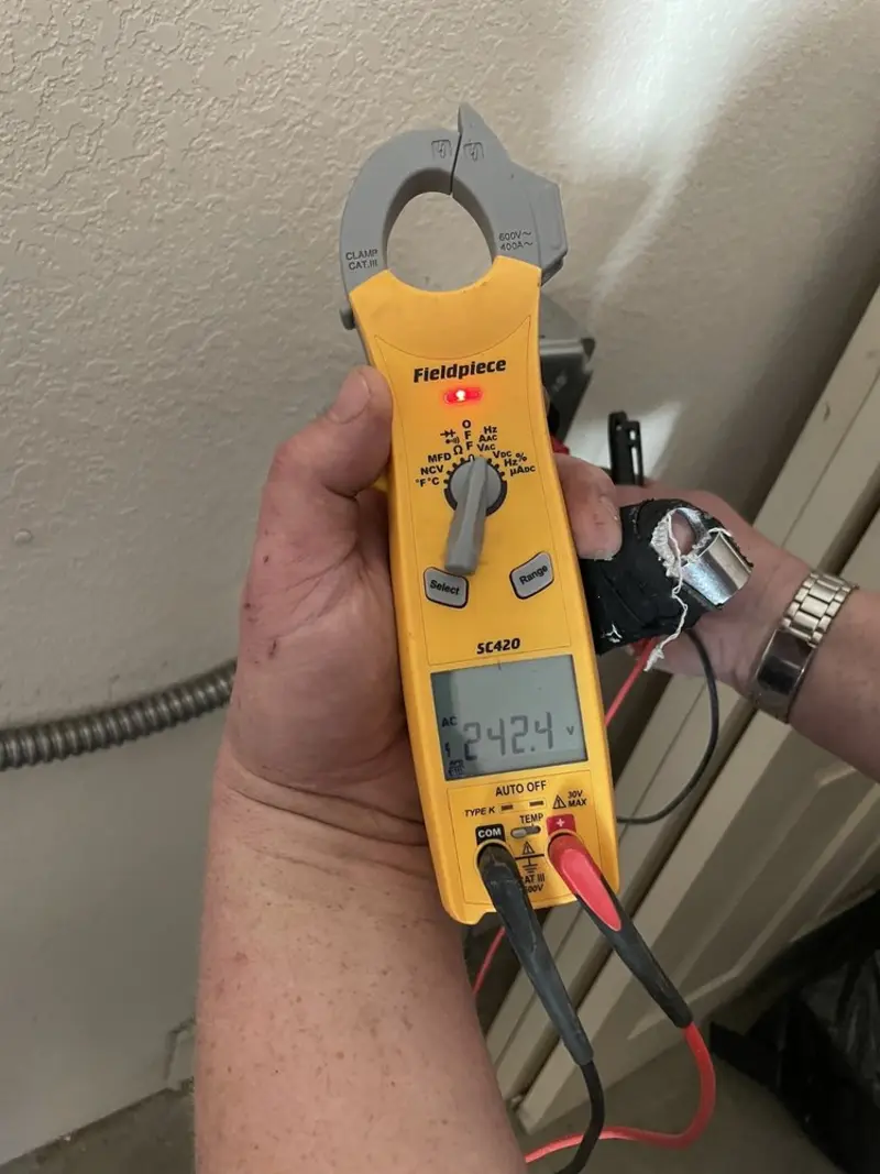 Voltage testing with clamp meter during Aluminum Wiring Replacement in Grasonville